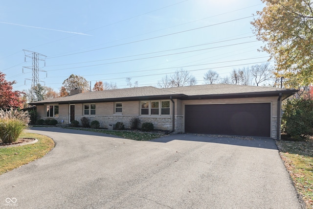 ranch-style house featuring a garage