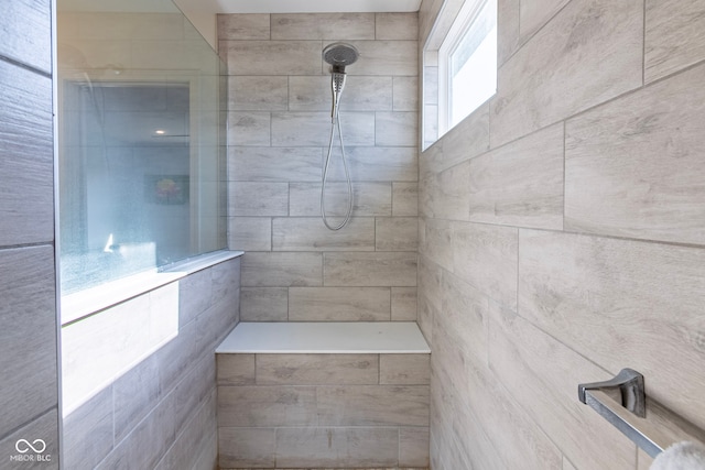 bathroom featuring tiled shower