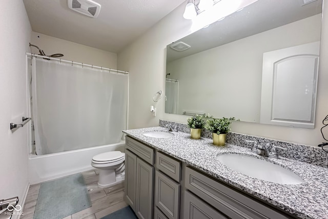 full bathroom with hardwood / wood-style floors, toilet, vanity, and shower / tub combo with curtain