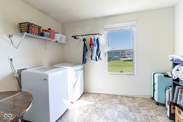 washroom with independent washer and dryer