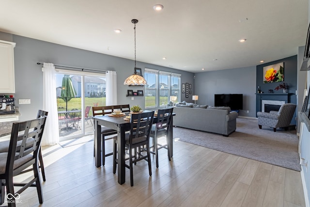 dining area featuring a high end fireplace