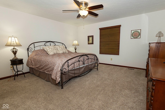 bedroom with ceiling fan and carpet floors