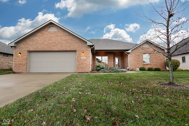 view of front of house featuring a garage and a front yard