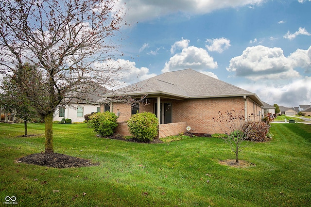 view of home's exterior with a lawn