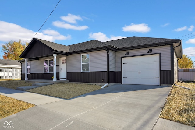 ranch-style home with a front yard and a garage