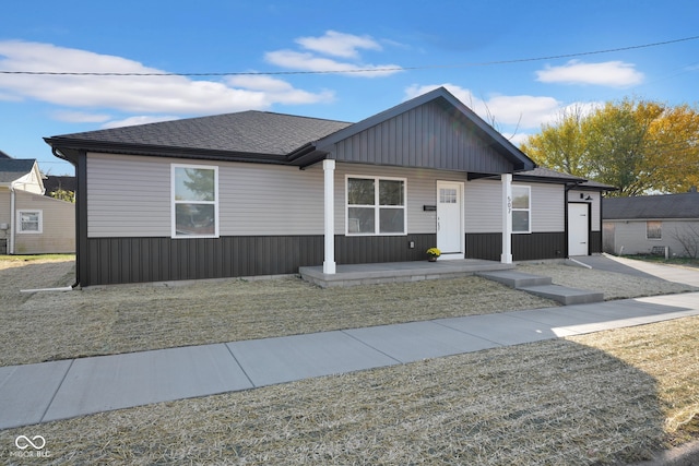 view of front of property with a front yard and covered porch