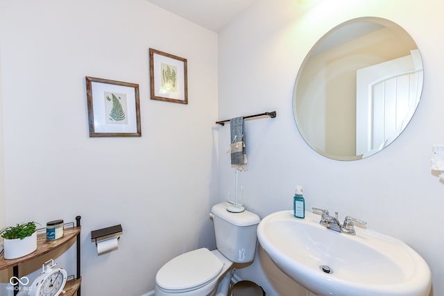 bathroom featuring sink and toilet