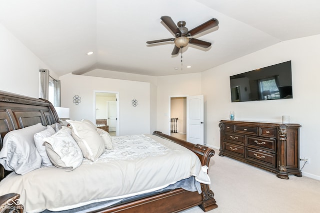 carpeted bedroom featuring ceiling fan and vaulted ceiling