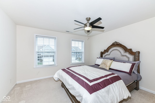 bedroom featuring ceiling fan and light colored carpet