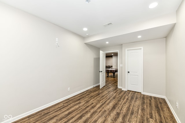 spare room with dark wood-type flooring