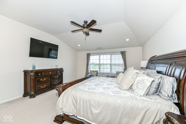 bedroom with ceiling fan, light colored carpet, and lofted ceiling