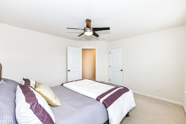 bedroom featuring ceiling fan and light colored carpet