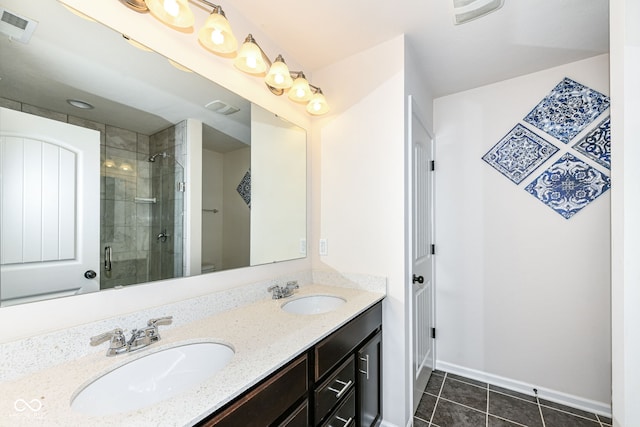 bathroom with toilet, vanity, tile patterned flooring, and a shower with door