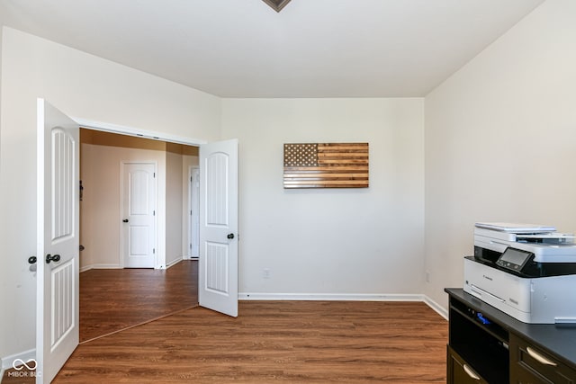 miscellaneous room with dark wood-type flooring