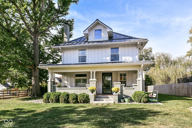 view of front of home featuring a front lawn and a porch