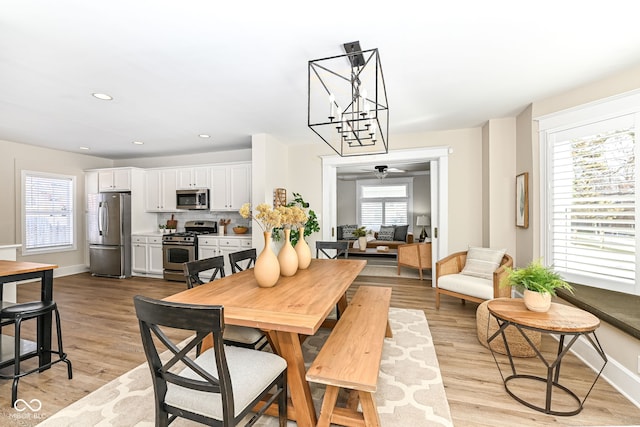 dining space featuring light wood-type flooring