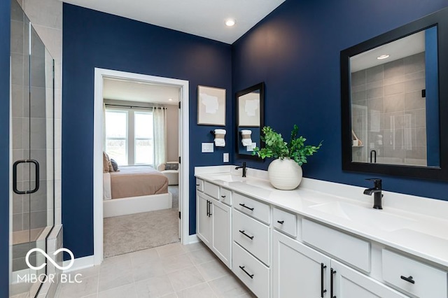 bathroom with vanity, walk in shower, and tile patterned flooring