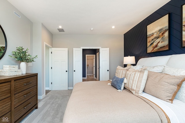 bedroom featuring light carpet