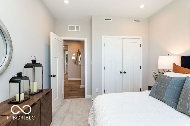 carpeted bedroom featuring a closet