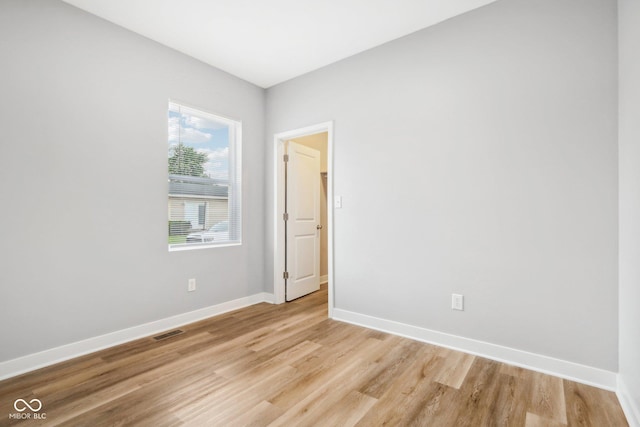 spare room featuring light hardwood / wood-style floors