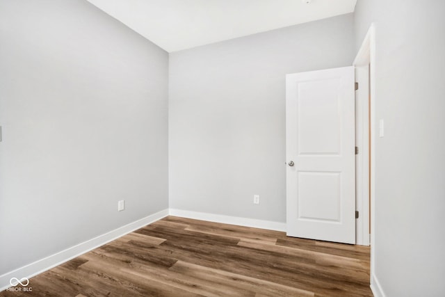 unfurnished room with hardwood / wood-style floors