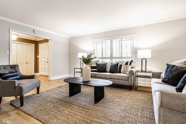 living room with hardwood / wood-style floors and ornamental molding