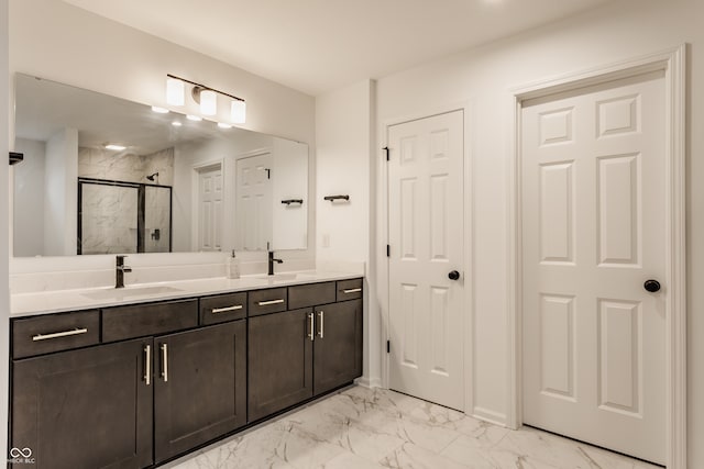 bathroom featuring vanity and a shower with shower door