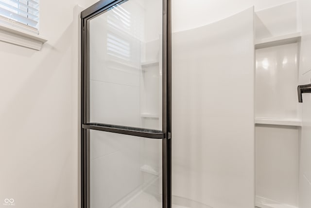 bathroom featuring an enclosed shower