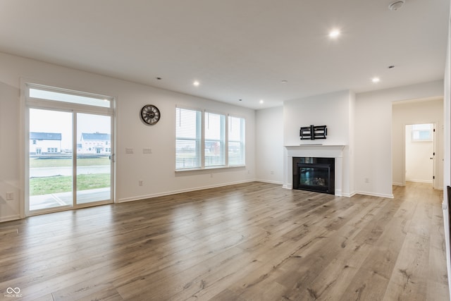 unfurnished living room featuring light hardwood / wood-style flooring