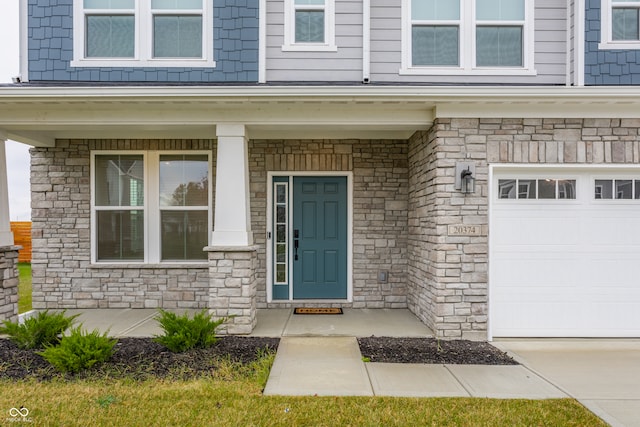 property entrance featuring covered porch