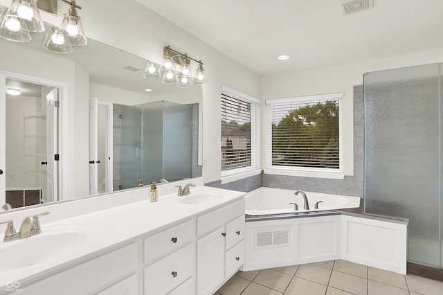 794 Princeton Ln, Westfield, IN 46074 - full bath featuring tile patterned floors, double vanity, a garden tub, and a shower with shower door