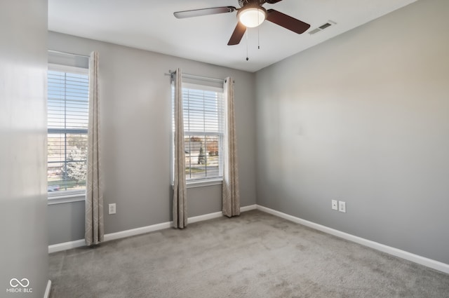 carpeted empty room with ceiling fan