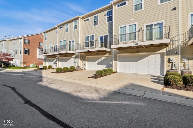 exterior space featuring a garage and central air condition unit