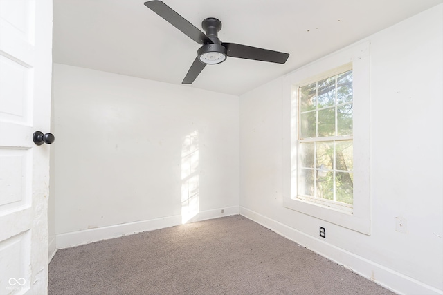 unfurnished room featuring ceiling fan, carpet, and plenty of natural light