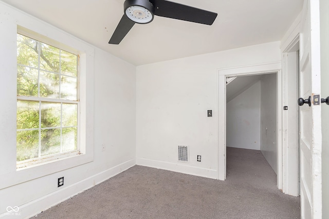 carpeted empty room featuring ceiling fan