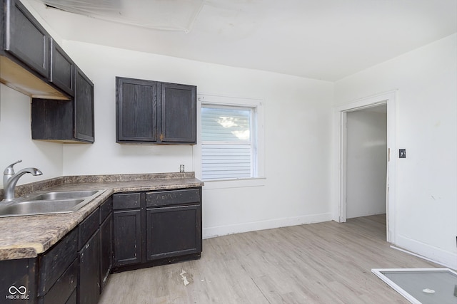 kitchen featuring sink and light wood-type flooring