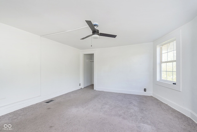 carpeted empty room with ceiling fan