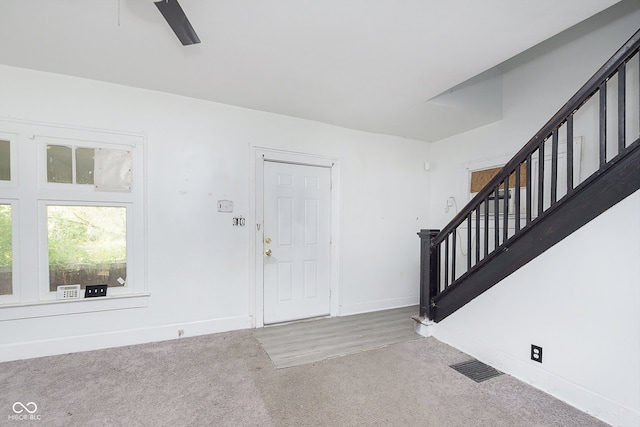 entrance foyer with carpet