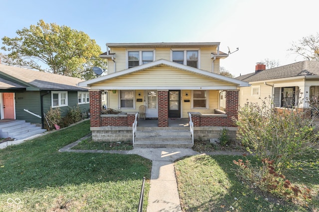 view of front of house featuring a porch and a front yard