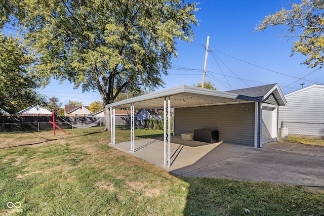 exterior space featuring a garage and an outbuilding