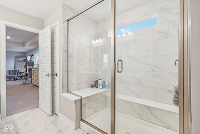 bathroom with a shower with shower door