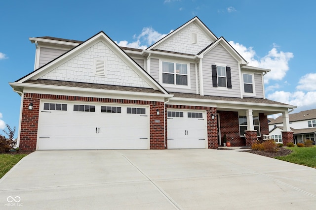 craftsman house with a porch and a garage