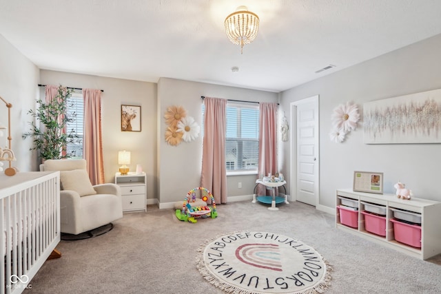 playroom featuring carpet flooring and an inviting chandelier