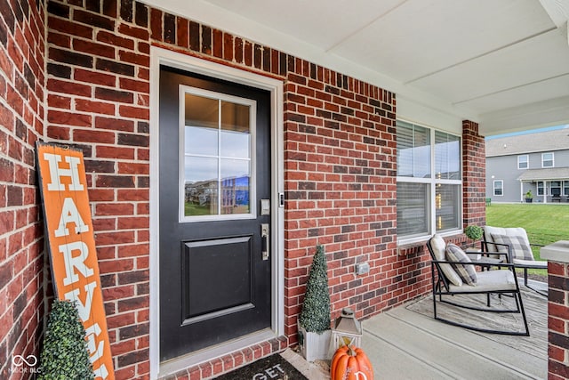 doorway to property with covered porch