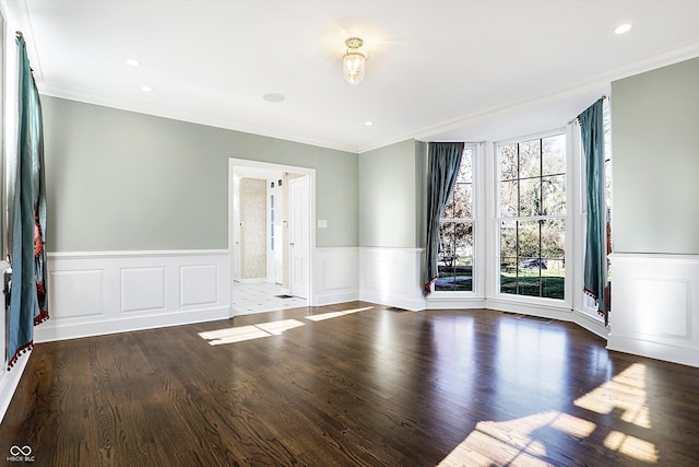 2505 Riverside Dr, Columbus, IN 47201 - spare room featuring ornamental molding, wainscoting, wood finished floors, a decorative wall, and recessed lighting