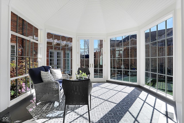 sunroom / solarium with a wealth of natural light and lofted ceiling