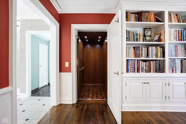 2505 Riverside Dr, Columbus, IN 47201 - hallway featuring a wainscoted wall, wood finished floors, and crown molding