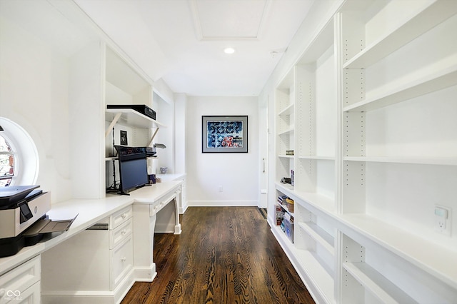 interior space with dark hardwood / wood-style floors and built in desk