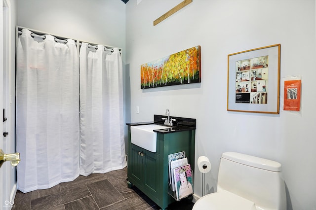 2505 Riverside Dr, Columbus, IN 47201 - full bathroom featuring vanity, toilet, and a shower with curtain