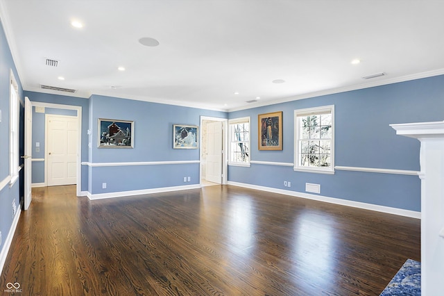 unfurnished room featuring ornamental molding and dark wood-type flooring